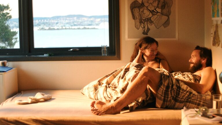 Couple in bed. Andrea Bræin Hovig and Thomas Gullestad in Motlys film. Intimate scene, relationship goals.