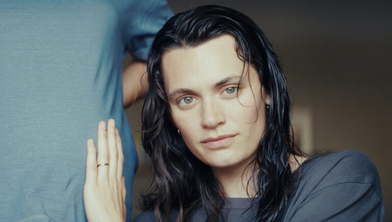 Love Letters film still, Cannes Film Festival. Woman with wet hair, hand on man's chest. La Semaine de la Critique.