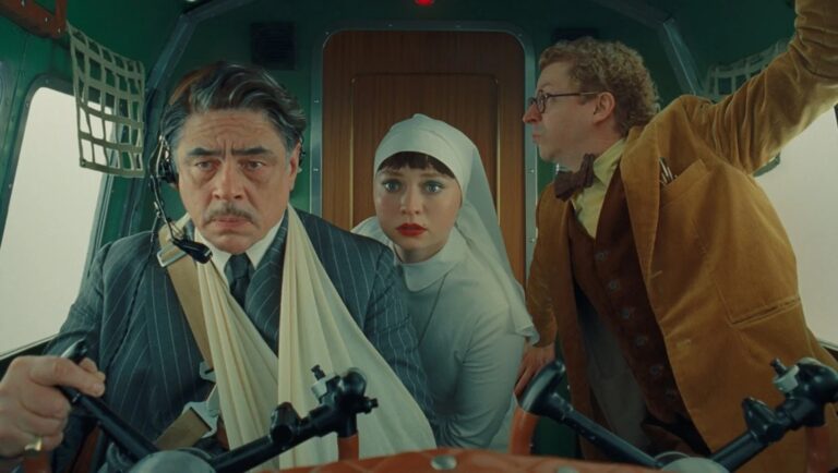 The Phoenician Scheme from Wes Anderson's Itchy & Scratchy Show. Benicio Del Toro, Léa Seydoux, and Stephen Park in a plane.