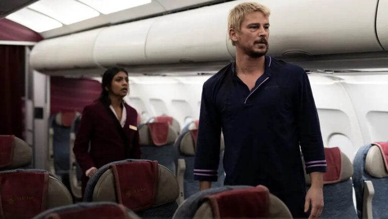 Joel Kinnaman and Varada Sethu in Fight or Flight on a plane.