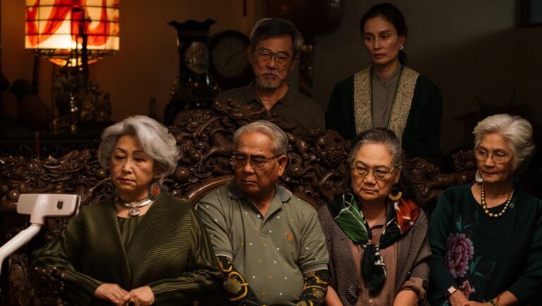 Useful Ghosts film still at Cannes Film Festival 2025. Cast members pose in a scene from the film.