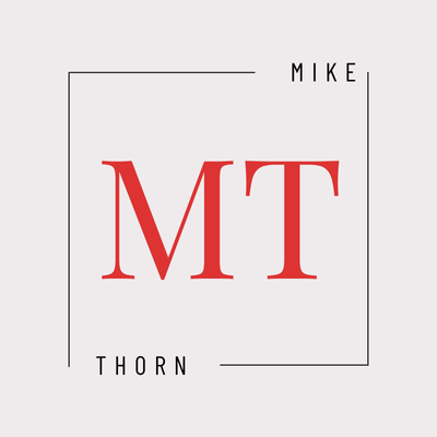 Mike Thorn logo. Red MT letters in a square frame. Modern, minimalist design.