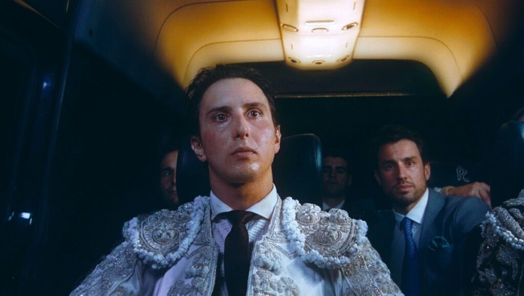 Albert Serra's Afternoons of Solitude film still. Man in ornate bullfighting jacket with solemn expression.