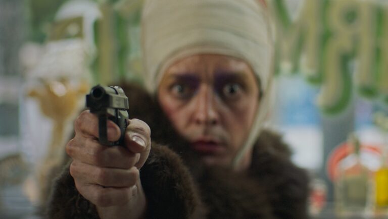 Woman with head bandage points gun. Crime scene, character with weapon. Fur coat, intense stare.