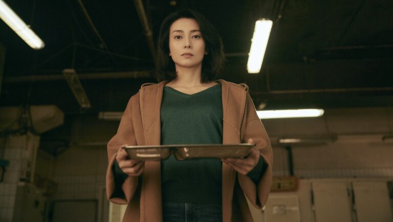 Woman holding tray in Serpent's Path movie still. Japanese film, revenge thriller.