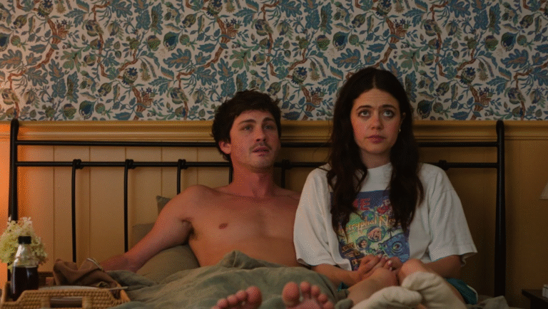 Logan Lerman and Margaret Qualley in bed in My Life With the Walter Boys on Netflix.