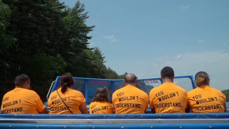 Wisconsin Dells boat tour with people wearing matching You Wouldn't Understand shirts. Family vacation.
