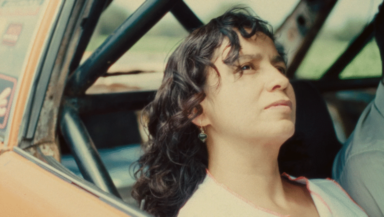 Film still from FIDMarseille 2025 film Copper, Headlights, Morlaix. Woman in car.