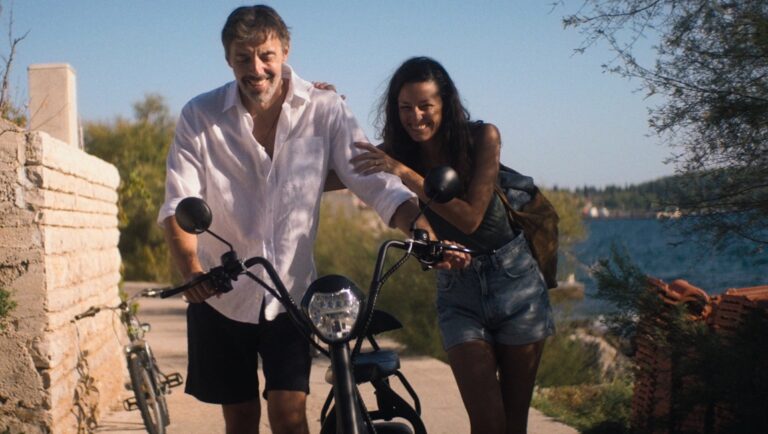 Couple on late summer vacation with e-bikes. Travel, lifestyle, and electric vehicle concepts.