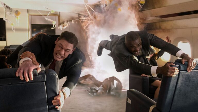 John Cena and Idris Elba in Heads of State movie scene. Airplane explosion. Action film.