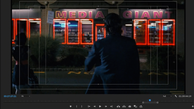 Video editing software interface. MEDIA GIANT store with neon lights, person in suit. Video heaven review.