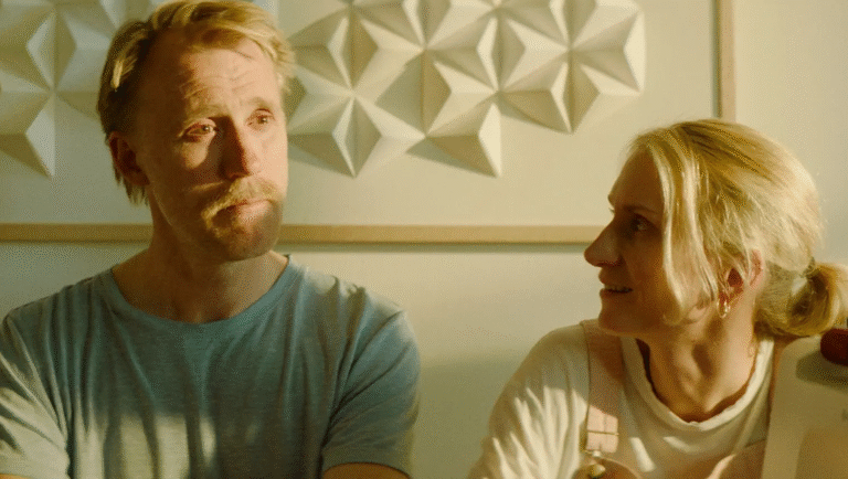 Sex 2025 film still. Man and woman in a domestic setting. Relationship drama.