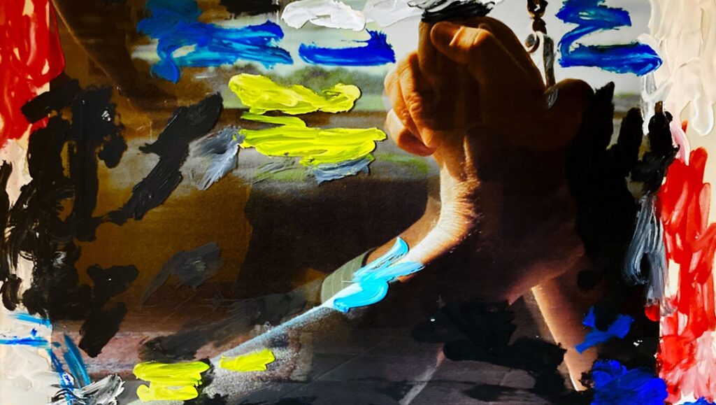 Abstract art with hands, paint strokes in red, blue, yellow, black, and white. Modern painting with textured brushstrokes.