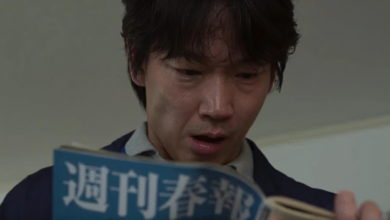 Asian man reading Japanese magazine. Surprised expression, news article, weekly publication.